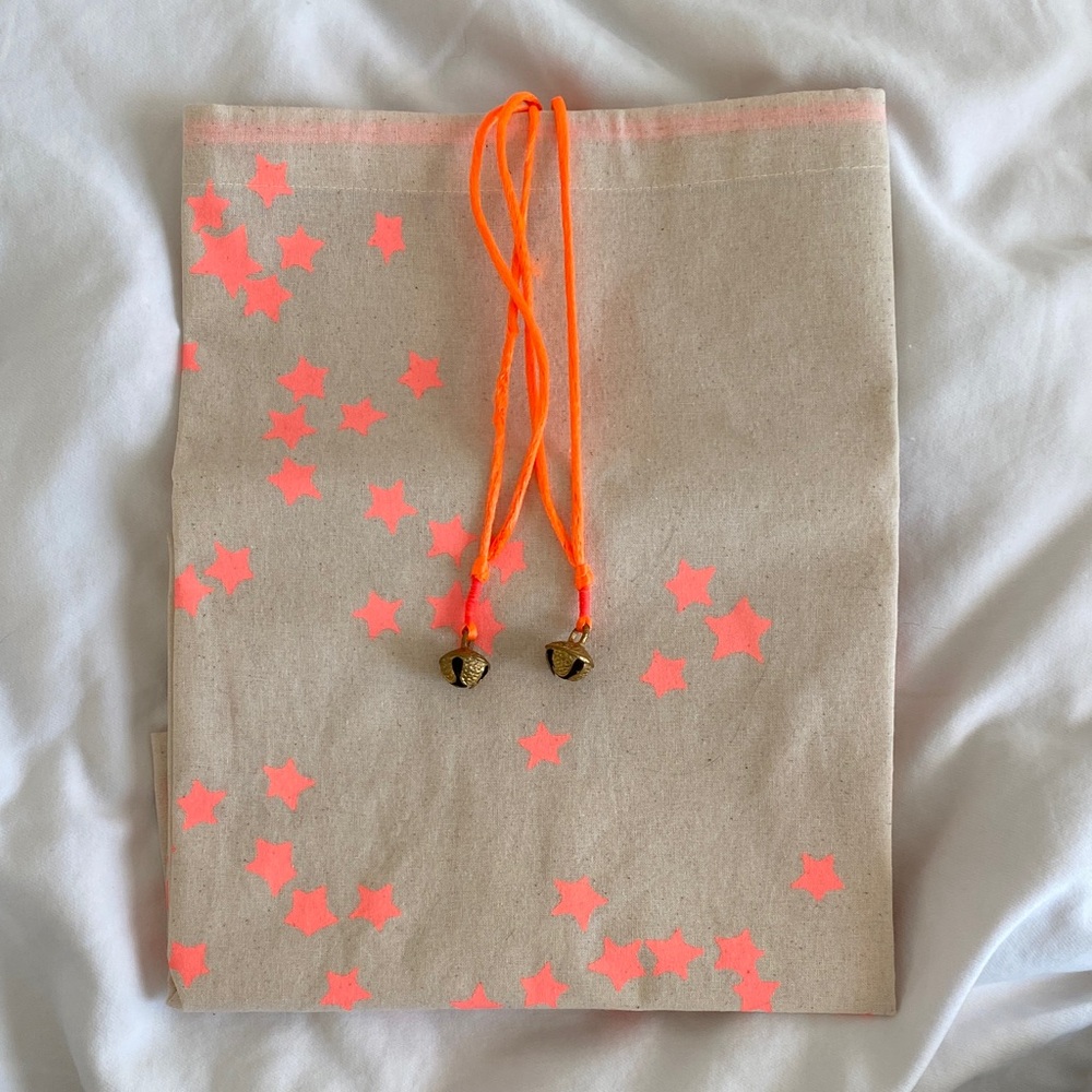 Free People Holiday Edition Star Pattern Drawstring Bag with Neon Accents